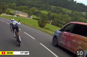 Marlen Reusser held up by UAE team van during Tour de France Femmes time trial (GCN)