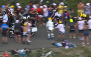 Motorbike riders block Tadej Pogacar on Col de Joux Plane, stage 14, 2023 Tour de France