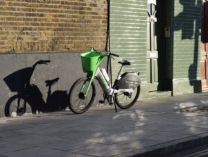 Lime bike on a pavement (Unsplash)