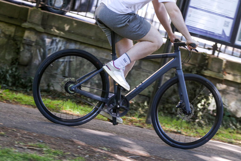 Canyon Commuter 5 bike ridden by a man in shorts on asfalt