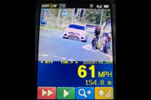 Driver speeding past child cyclist