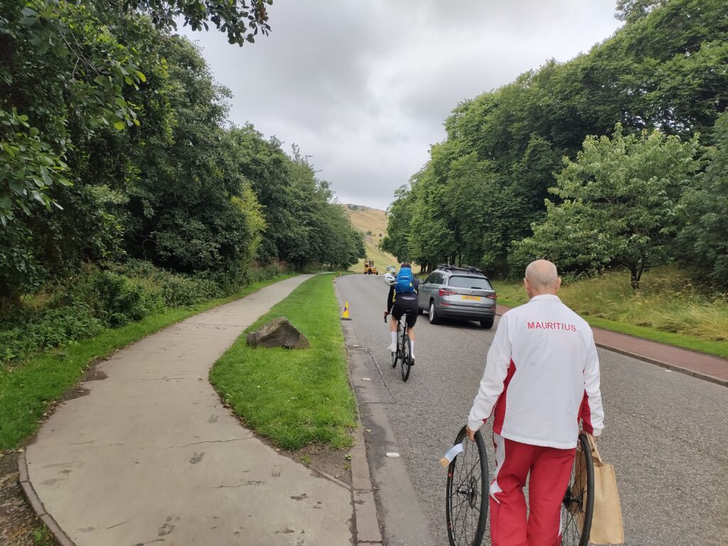 The Mauritius rider and soigneur make their way to the start of the 2023 men’s elite world road race championships in Edinburgh (Ryan Mallon)