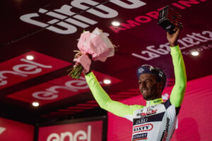 Biniam Girmay winces on the Giro podium (Zac Williams/SWpix.com)