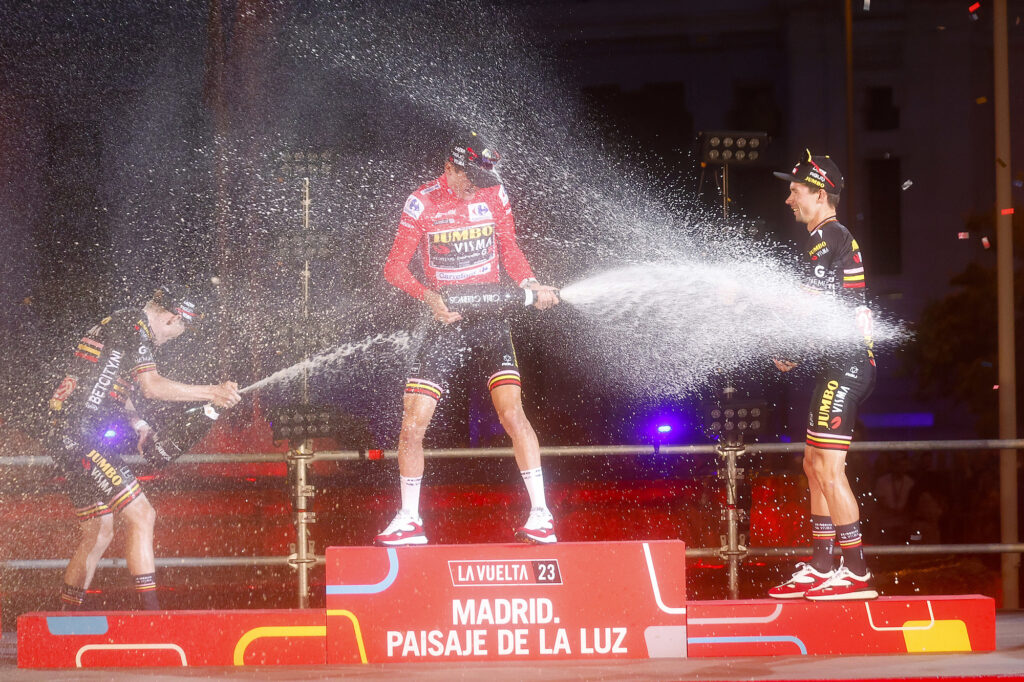 Sepp Kuss, Jonas Vingegaard, and Primož Roglič celebrate after stage 21, 2023 Vuelta a Espa&ntilde;a (Rafa Gomez/SprintCyclingAgency)