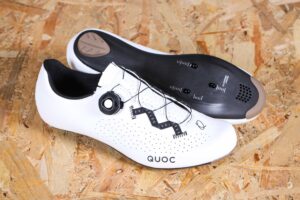 white Quoc Escape Road shoes on wooden background