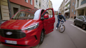 Cyclist almost gets doored by a driver in Ford Transit