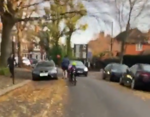 Motorist close passes child on bike on School Street