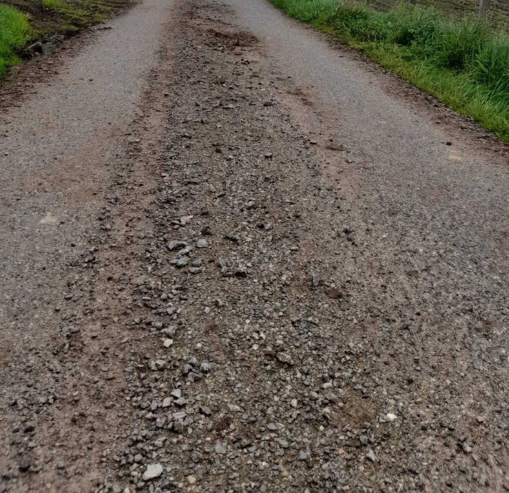 Potholes and loose gravel (Neil Innes)