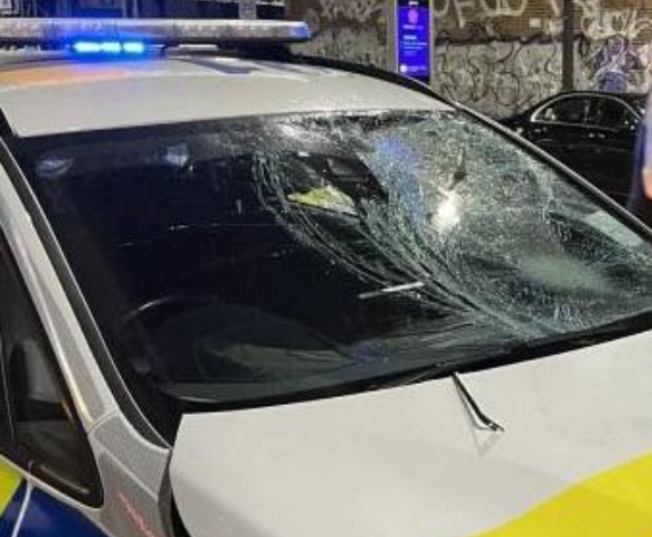 Damage to windscreen after police officer driving on wrong side of road hits cyclist