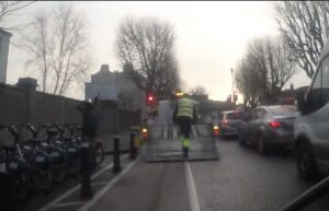 Truck dropping off hire bikes at rental station blocking cycle lane, Dublin