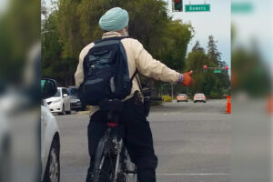 Turban wearing cyclist (licensed CC BY-SA 2.0 DEED on Flickr by Richard Masoner : Cyclelicious) – v2