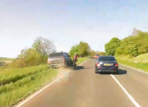Driver mounts grass verge to undertake cyclist