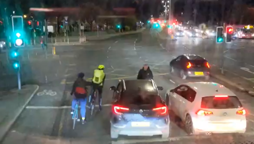 Road rage driver gets out of car to threaten cyclists after pulling into bike box