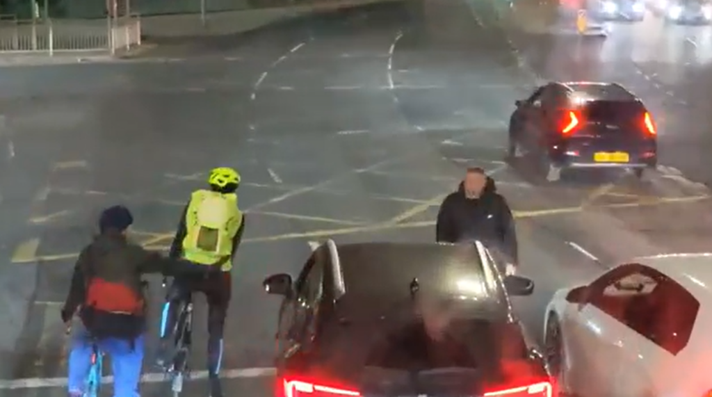 Road rage motorist gets out of car to threaten cyclists after pulling into bike box