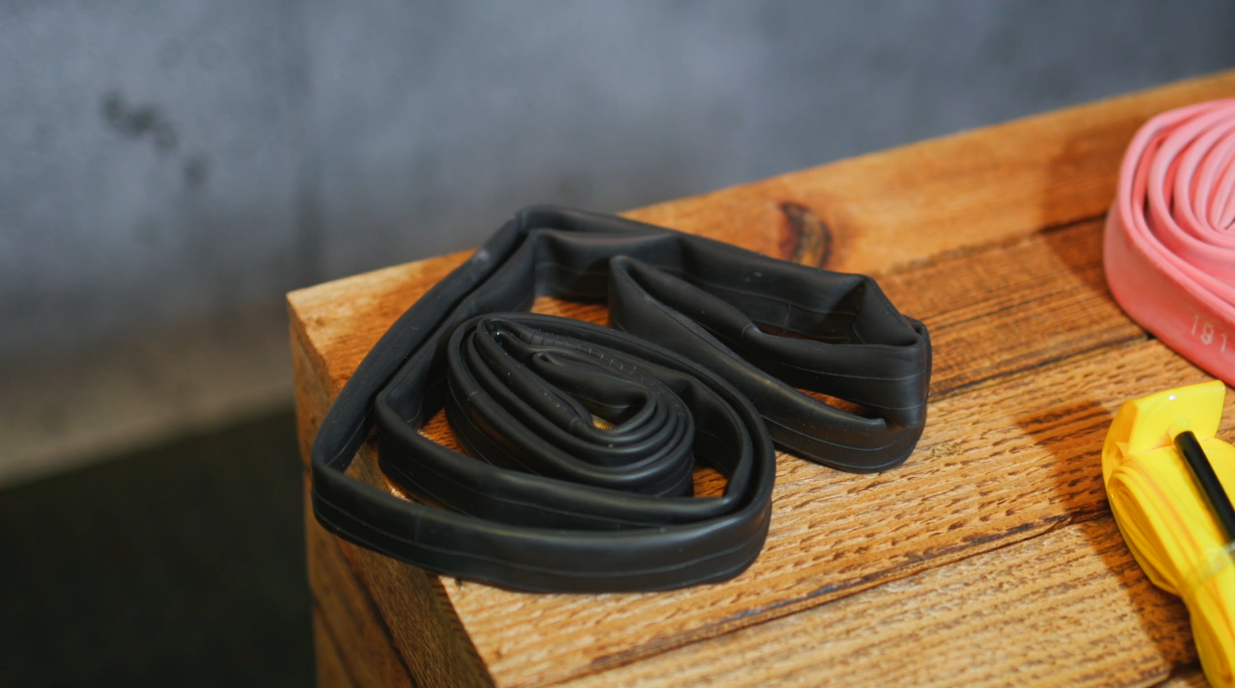 2024 Butyl road bike inner tube next to TPU and Latex