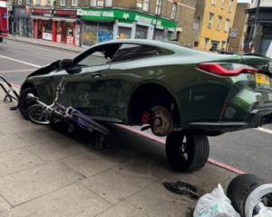 BMW driver crashes into London bike stand
