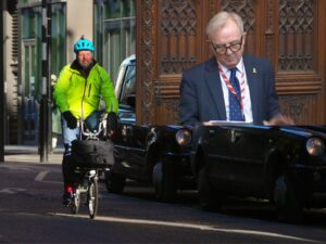Cyclist next to cabs in London/Lord Ian Austin