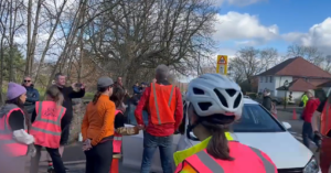 Motorist mounts pavement and attempts to drive through ‘die-in’ in Sheffield (credit – llamasteve, Twitter)