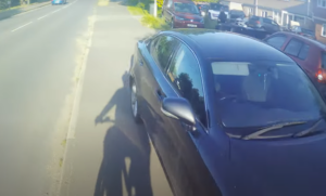 Motorist parked blocking shared use cycle and pedestrian path tells cyclist to “get on the road”