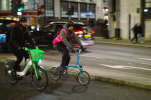 Cyclists in London brompton and lime hire bike – copyright Simon MacMichael