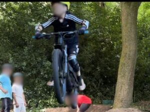 Child riding bike in Garw Wood, South Wales (Robin Willis)