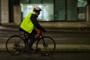 Cyclist in London at night in winter clothing – copyright Simon MacMichael