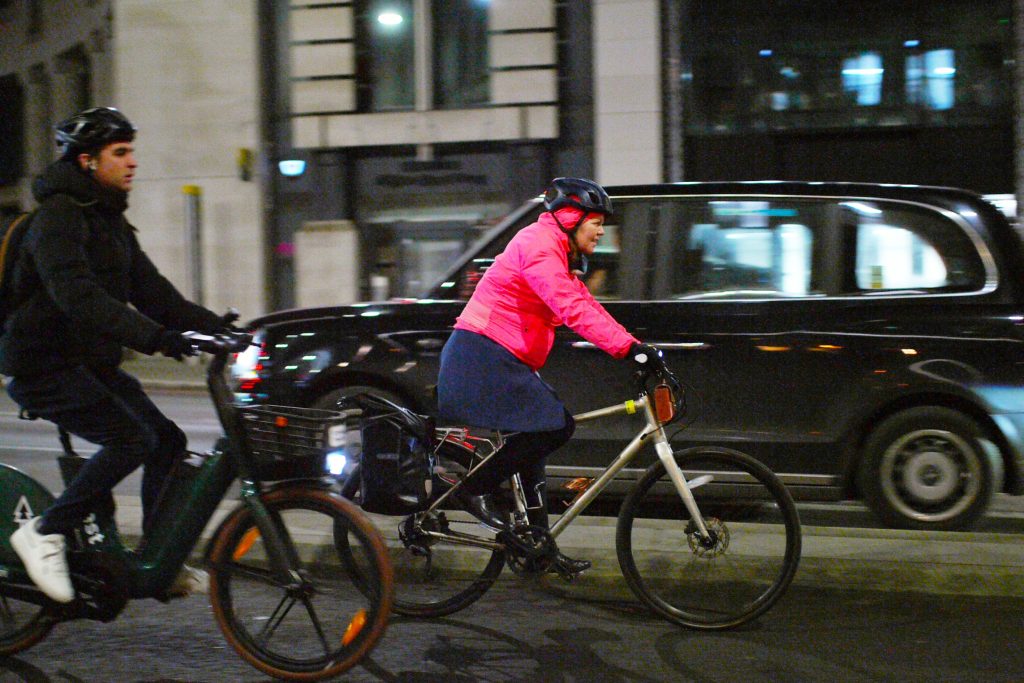 Cyclists in London male and female in cycle lane &ndash; copyright Simon MacMichael