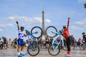 London to Paris cyclists in front of the Eiffel Tower