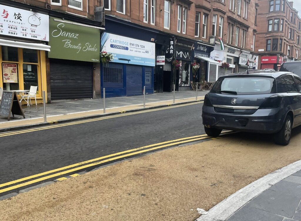 New bollards and drivers parking on cycle lane on Byres Road, Glasgow