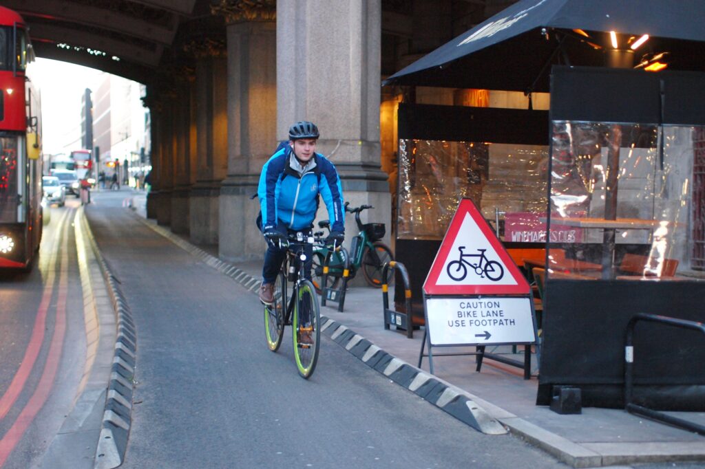 Cyclist in London caution bike lane use footpath &ndash; copyright Simon MacMichael