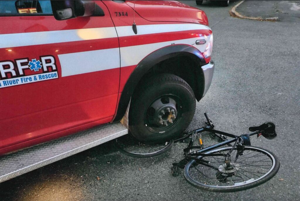 Smashed bike under ambulance which crashed into cyclist