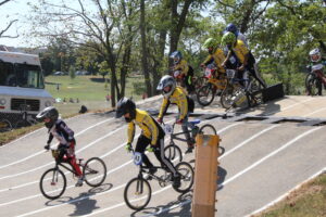 Kids riding BMX bikes (by Eli Christman on Flickr, licensed by CC BY 2.0)