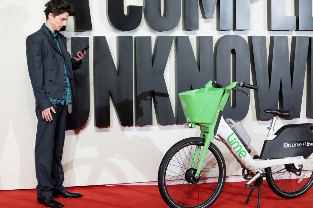 Timothée Chalamet parks Lime bike at London premiere of A Complete Unknown