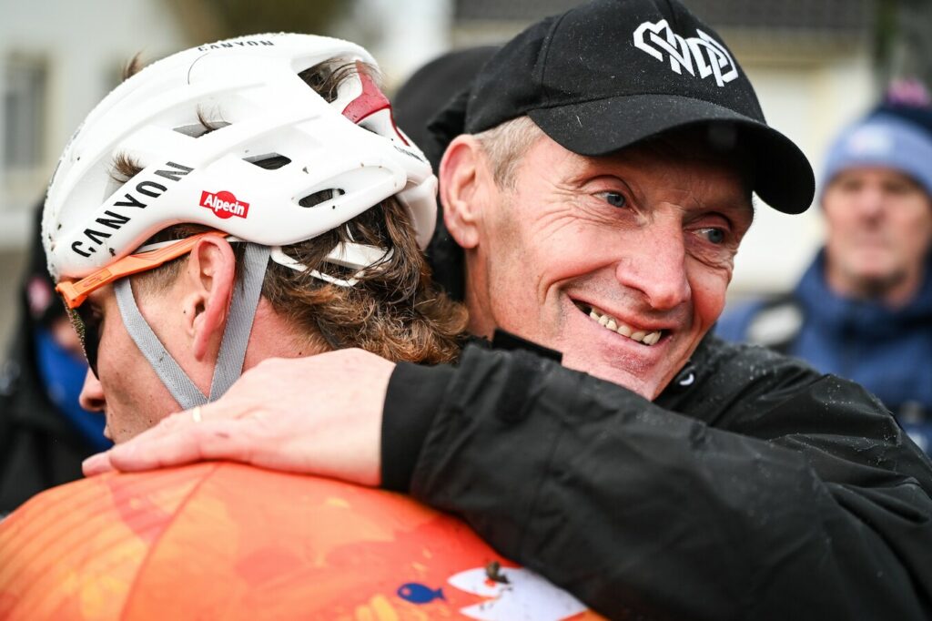 Adrie and Mathieu van der Poel celebrate after Mathieu's record eighth cyclocross world title