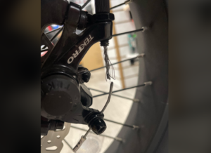 Hanging on by a thread brake cable