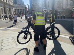 City of London cycle team police stop and fine cyclist running red light