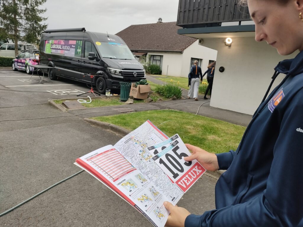 Mia Griffin checks the roadbook, 2026 Paris-Roubaix Femmes