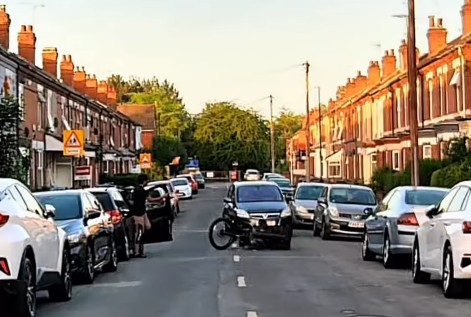 Cyclist doored by car driver on residential street 2
