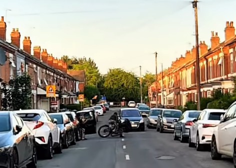 Cyclist doored by car driver on residential street