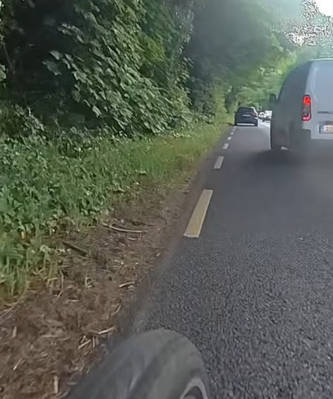 Cyclist riding on busy road near Dublin