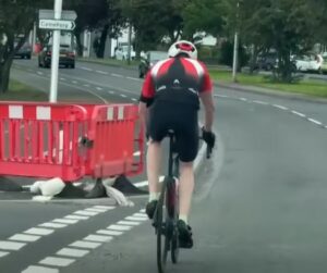 Cyclist riding on road beside Methil cycle lane