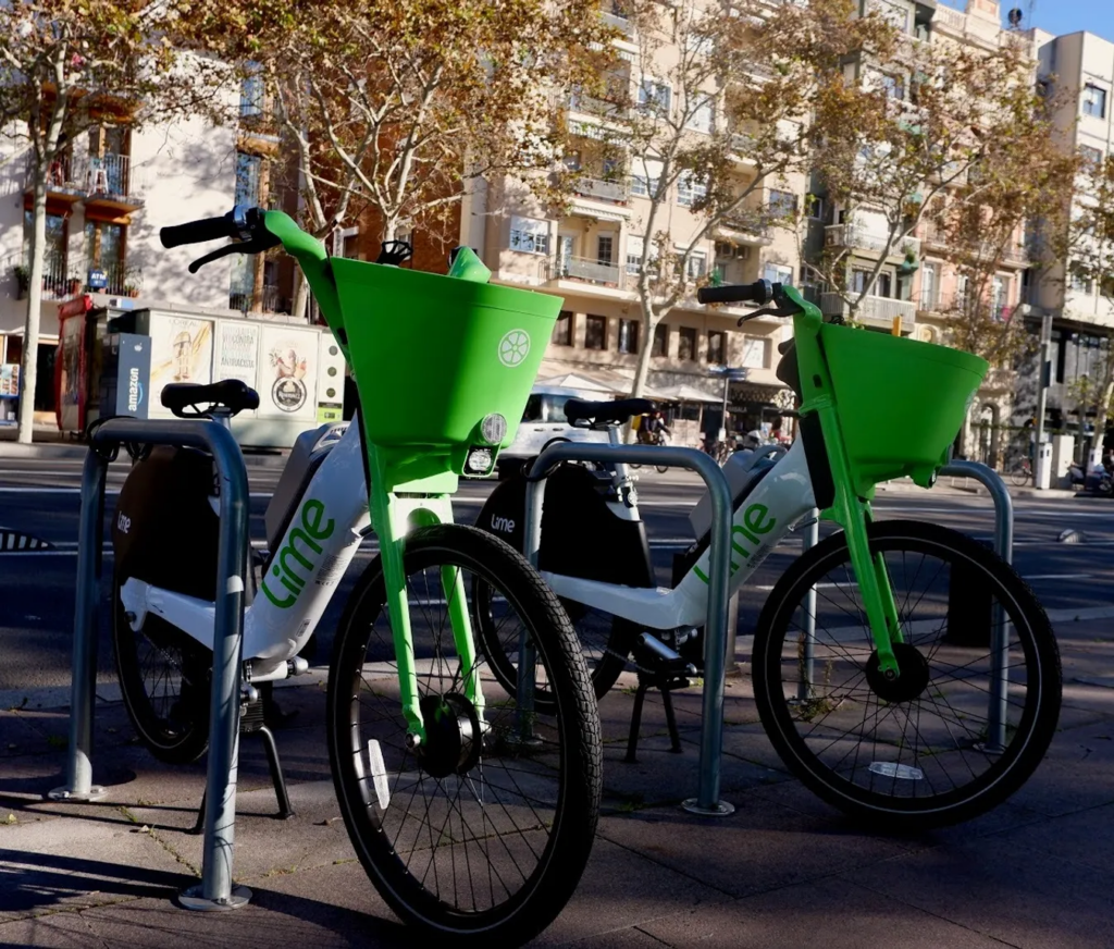 Lime bikes parked at racks in Barcelona