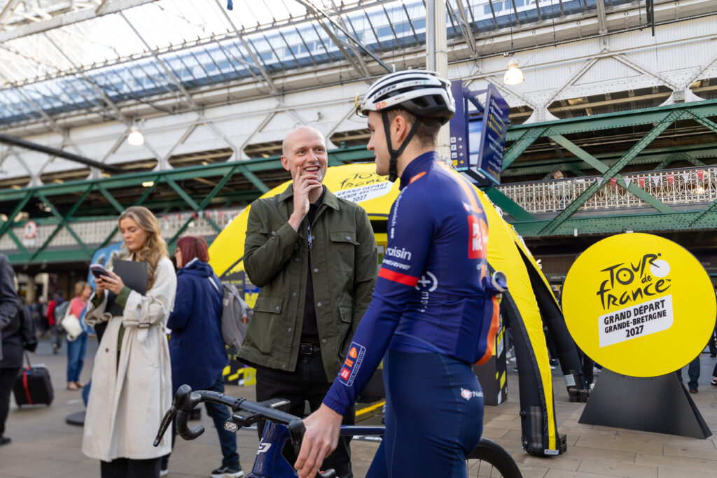 Cabinet Secretary Stephen Flynn with procyclist Sean Flynn