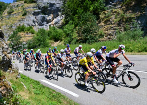 2026 Tour de France stage 18 peloton with Tadej Pogacar in black shorts