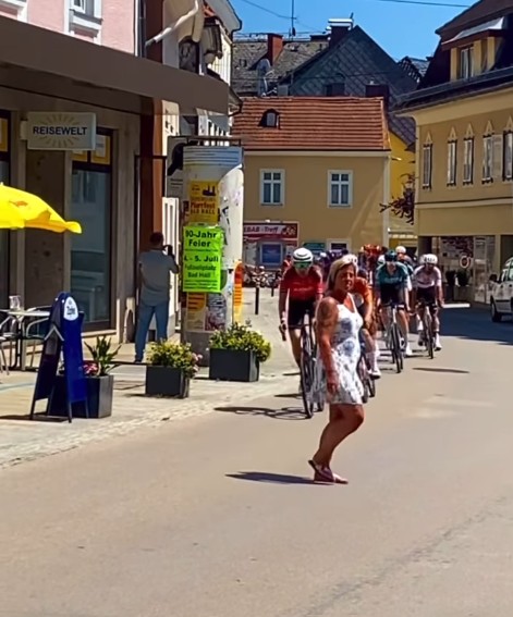 Tour of Austrian spectator walks out in front of bunch