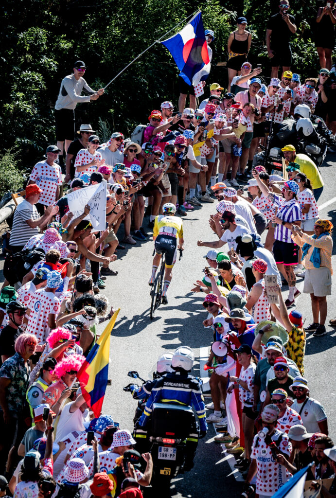 Tadej Pogacar riding through crowds on Alpe d'Huez, stage 19, 2026 Tour de France
