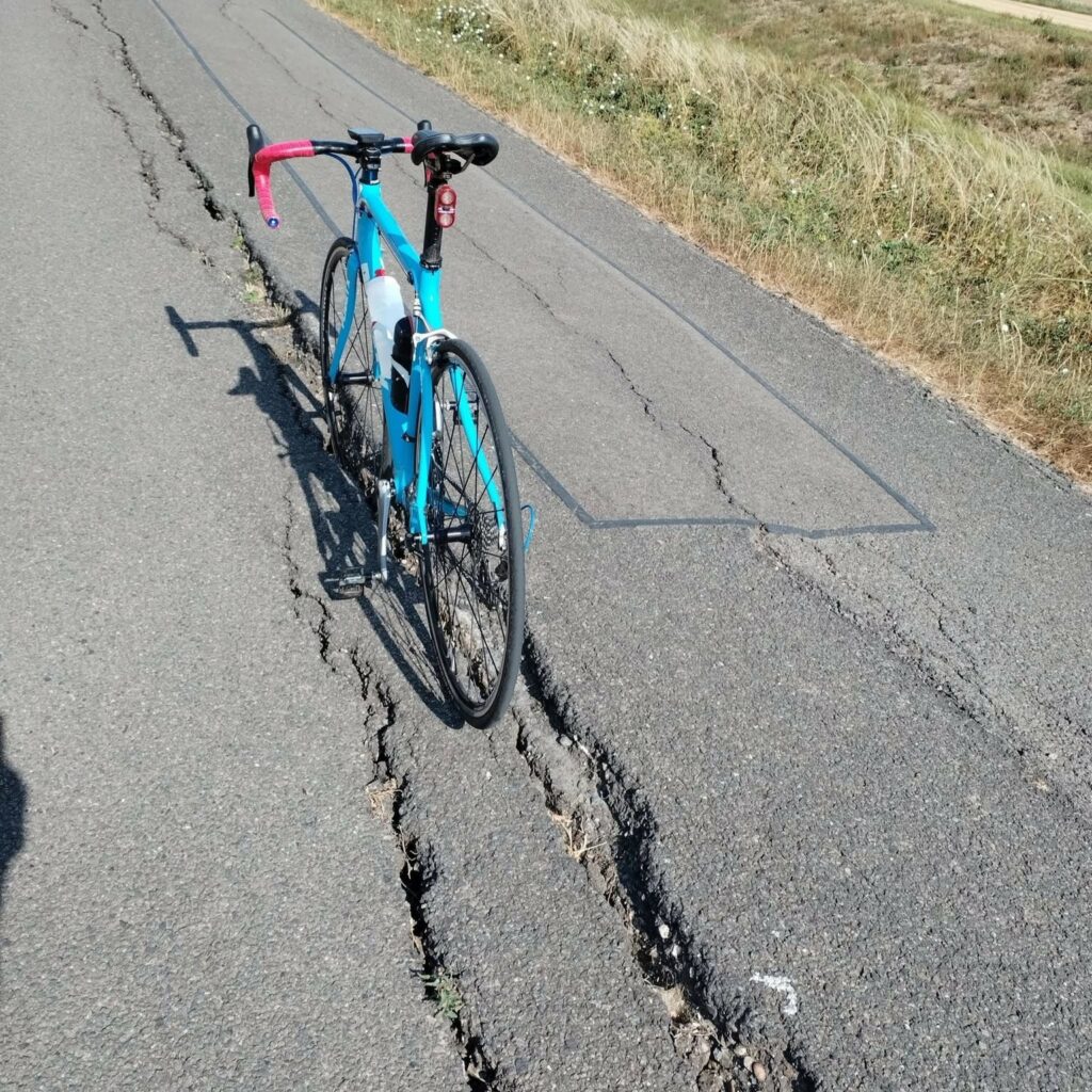 Lincolnshire bike in road crack