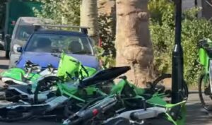 “Let’s have more spaces to park them and this won’t happen”: Lime bikes accused of damaging vehicles as “hundreds” dumped on street – but cyclists say there are “too many cars” + more on the live blog