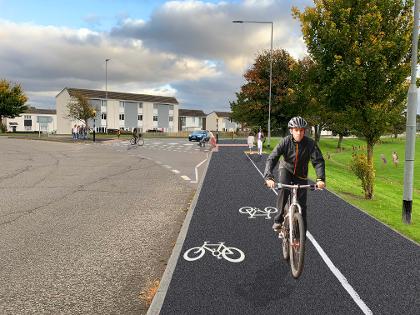 Police oppose new cycle lane amid fears of “a highway for illegal e-bikes on drug runs” – but council insists area will be safer and avoid “mania” of local roads