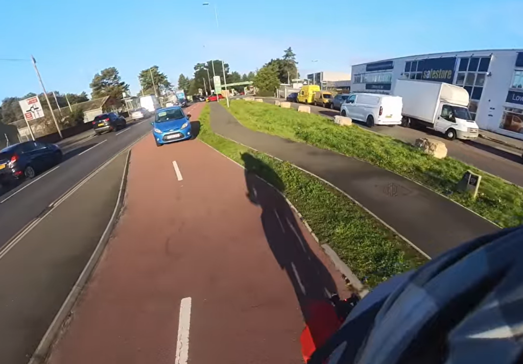 Motorist driving on cycle lane in Bournemouth